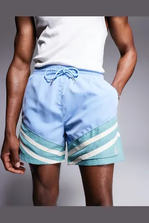 Alma de Ace Pantalones cortos azules con diseño color block de