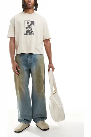 Hollister Vaqueros azules de corte skater holgado con lavado medio efecto manchas de grasa de