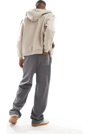 ASOS Joggers gris carbón de pernera ancha con estampado en relieve premium de