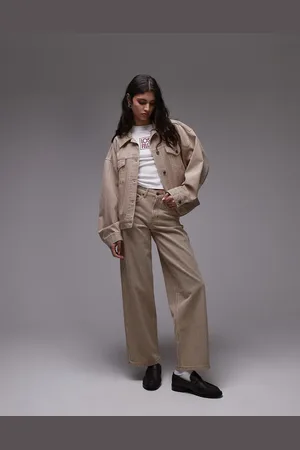 Topshop Vaqueros color tostado a rayas de talle bajo y corte holgado con detalle regulable de -Marrón
