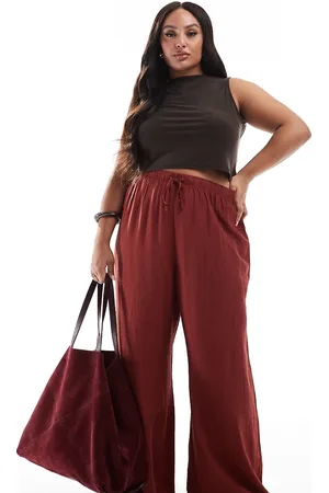 New Look Pantalones color óxido de pernera ancha de tejido efecto rugoso de New Look Curve-Marrón