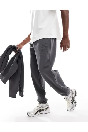 ASOS Joggers gris carbón extragrandes con estampado en relieve premium de