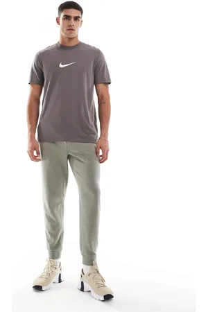 Nike Joggers grises Dri-FIT Primary de -Verde