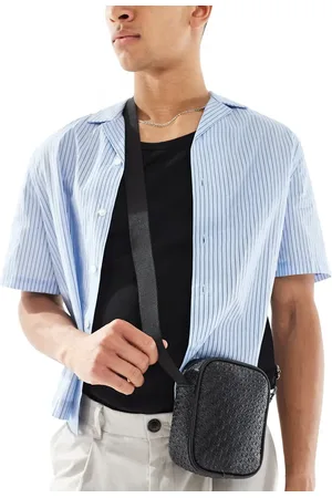 ASOS Bandolera pequeña negra con diseño grabado de