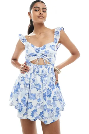 Hollister Mono corto azul con estampado floral, abertura y mangas con volante de