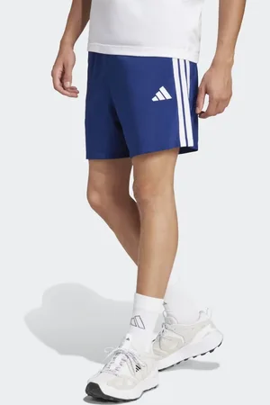 adidas Pantalones cortos azul oscuro y blancos con detalle de 3 rayas Chelsea Essentials de