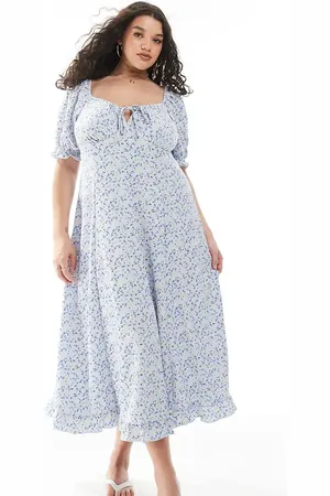 New Look Vestido midi azul de estilo mesonera con estampado floral de tejido rugoso de New Look Curve