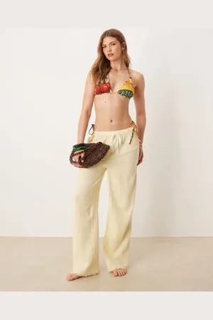 ASOS Pantalones playeros amarillo pastel con bajo desflecado de bambula Callie de
