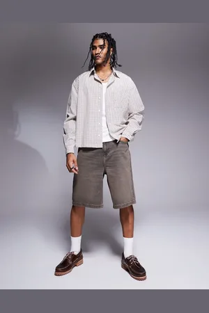 ASOS Pantalones cortos vaqueros de corte alargado con tintado marrón vintage de