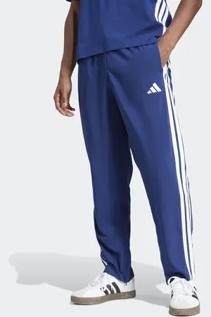 adidas Pantalones azul oscuro y blancos con bajo amplio y 3 rayas Essentials Stanford de
