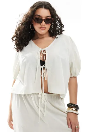 Esmée Top playero color con mangas abullonadas y lazada delantera exclusivo de -Neutro