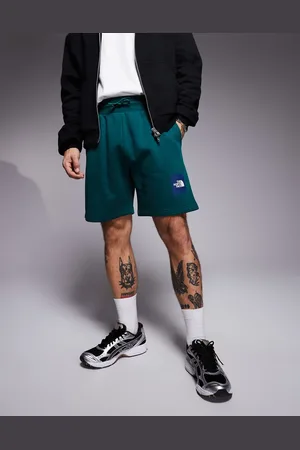 The North Face Pantalones cortos de chándal verdes con logo Box NSE de