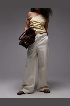 MANGO Pantalones blancos de pernera ancha con cintura elástica de