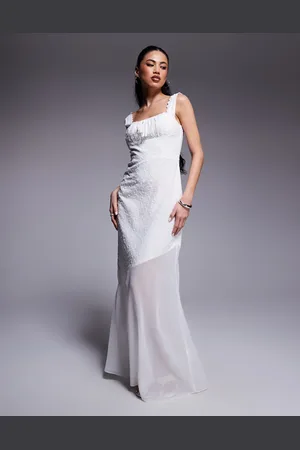 Kaiia Vestido largo traslúcido con bordado inglés, detalle de lazada en el pecho y bajo asimétrico de algodón exclusivo de
