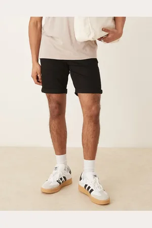 ASOS Pantalones cortos vaqueros negros elásticos de largo estándar y corte slim de