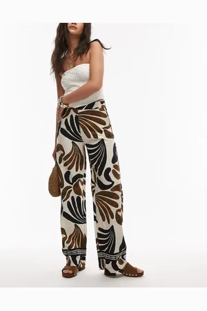 MANGO Pantalones beis claro de pernera ancha con estampado abstracto de -Neutro