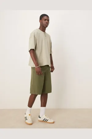 ASOS Pantalones cortos verdes de corte alargado ancho con patrón de espiga de