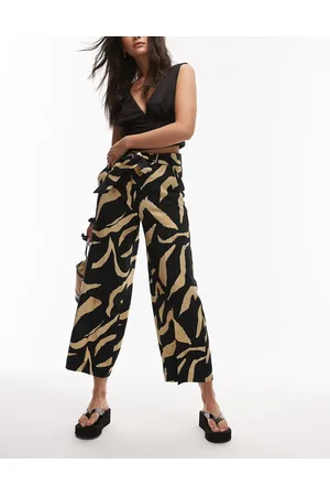 MANGO Pantalones negros de pernera ancha con estampado abstracto de