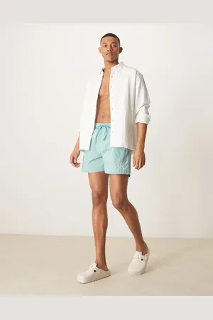 Calvin Klein Shorts de baño azul aguamarina con cordón ajustable y logo de