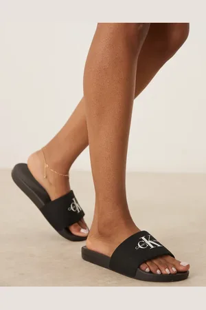 Calvin Klein Sandalias negras con monograma de -Negro