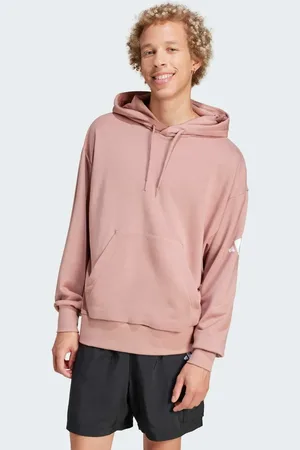 adidas Sudadera color arcilla cálido y blanca básica de corte suelto con capucha y logo de 3 barras de felpa de rizo Essentials de -Naranja