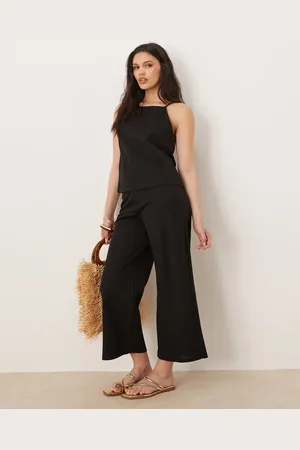 MANGO Pantalones negros de pernera ancha con cintura elástica de mezcla de lino de (parte de un conjunto)