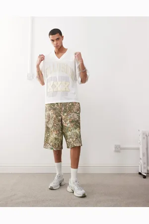 COLLUSION Pantalones cortos holgados con estampado de camuflaje de árbol de punto liso de