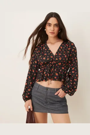 MANGO Blusa negra con estampado de rosas y lazada delantera de