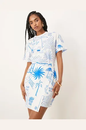 Never Fully Dressed Vestido corto color crema con lazada en la cintura y estampado de palmera de -Blanco