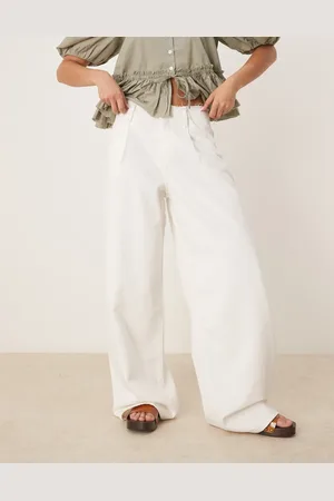 MANGO Pantalones blancos de pernera ancha con cinturilla sin rematar de