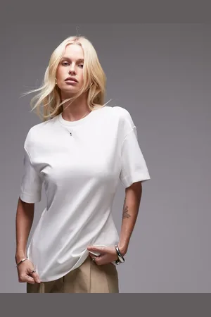 MANGO Top con diseño estructurado y sobrefalda de la colección cápsula de