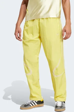 adidas Pantalones de chándal color azufre y amarillo pálido Adicolor 2000s de
