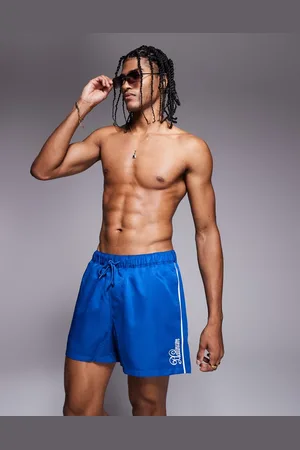 ASOS Shorts de baño cortos azules con detalle bordado de