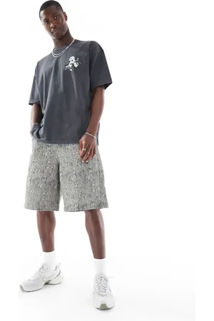 ASOS Pantalones cortos de corte alargado con estampado de camuflaje de