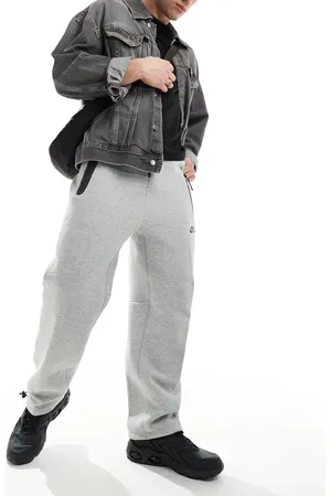Nike Joggers grises sueltos con cordón ajustable de felpa Tech Fleece de