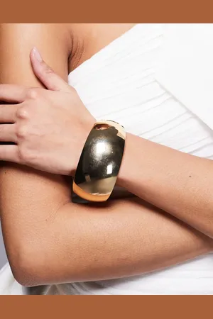 Kaiia Pulsera rígida dorada gruesa exclusiva de