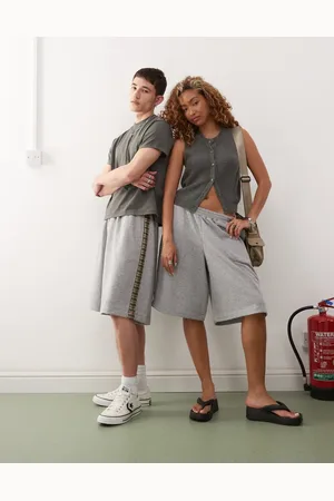 Reclaimed Pantalones cortos unisex con detalle de cuadros en el lateral de punto liso de