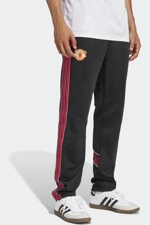 adidas Pantalones de chándal negros con diseño del Manchester United 