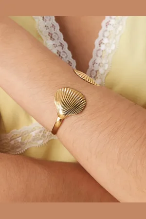 ASOS Pulsera dorada rígida con detalle de conchas de acero inoxidable resistente al agua de