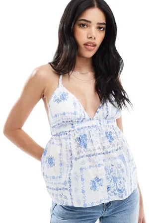 Hollister Top blanco sin mangas con estampado floral azul, cuello halter y espalda abierta de