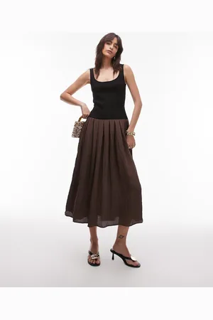 MANGO Vestido claro plisado con cintura baja en contraste de