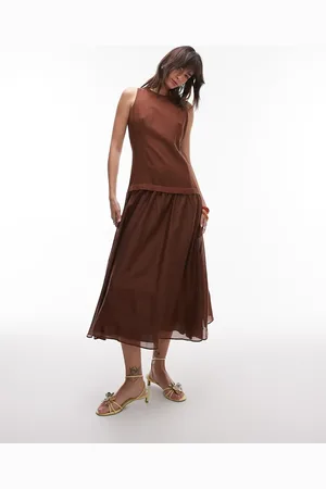 MANGO Vestido largo marrón con talle bajo y bajo transparente de lino de