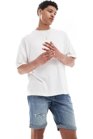 River Island Pantalones cortos vaqueros de corte slim con lavado medio de