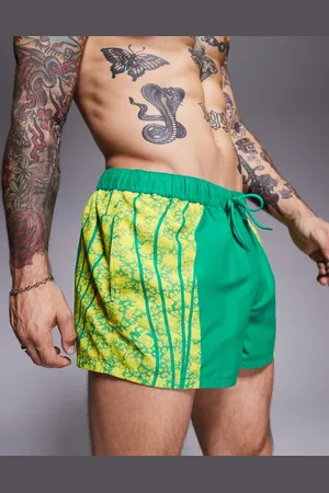ASOS Shorts de baño muy cortos verdes con estampado animal de