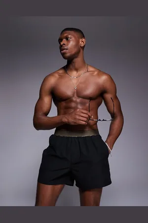 ASOS Shorts de baño cortos negros con detalle de cinturilla elástica en contraste de
