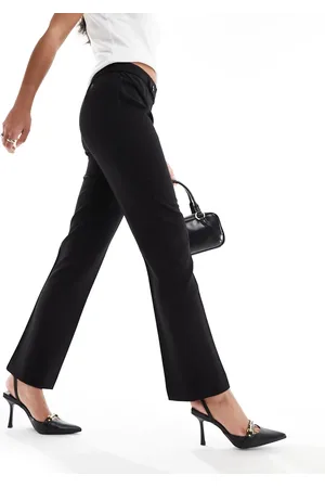MANGO Pantalones negros de corte slim con botones en la cintura de