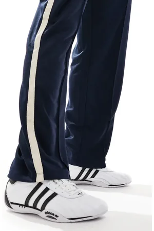 adidas Zapatillas de deporte blancas y negras de caña baja Adracer Low de