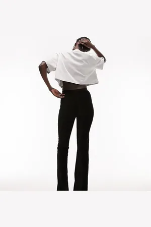 Topshop Pantalones de campana negros elásticos de pana aterciopelada de