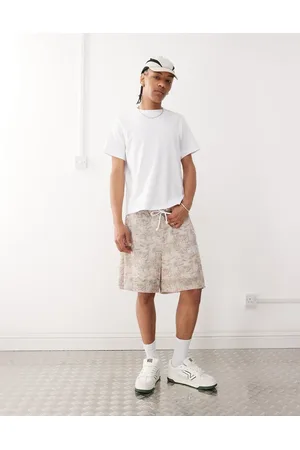 ASOS Pantalones cortos extragrandes con estampado de ramas de -Neutro