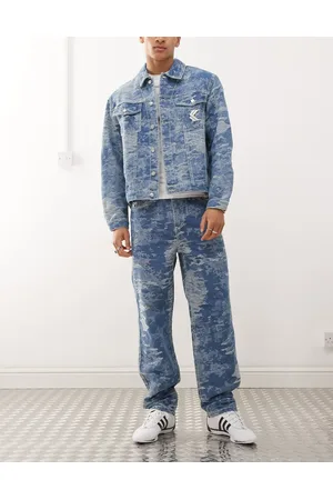 Karl Kani Vaqueros con lavado medio, cinco bolsillos y estampado de camuflaje desgastado OG de